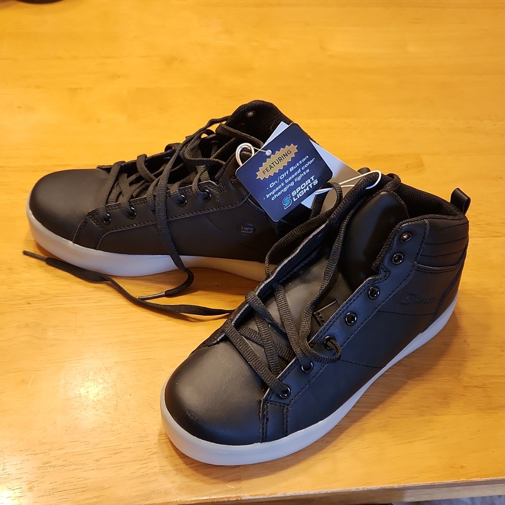 Youth Size 4 high top light up shoes. Brand New. Never Worn. Tags Still On.Black